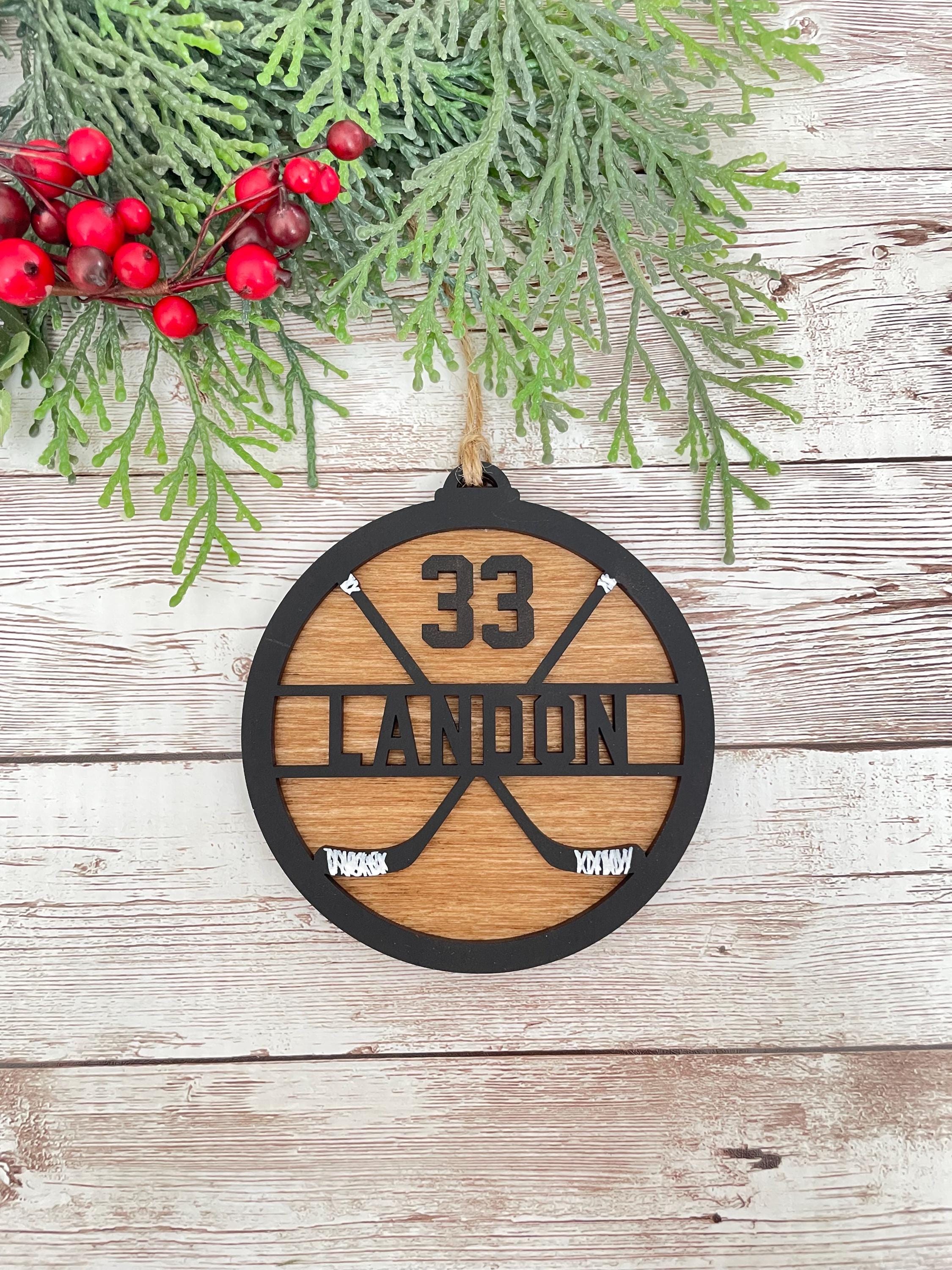 Hockey personalized ornament wood handmade black paint wood stained background twine string to hand sticks hockey team coach manager gift