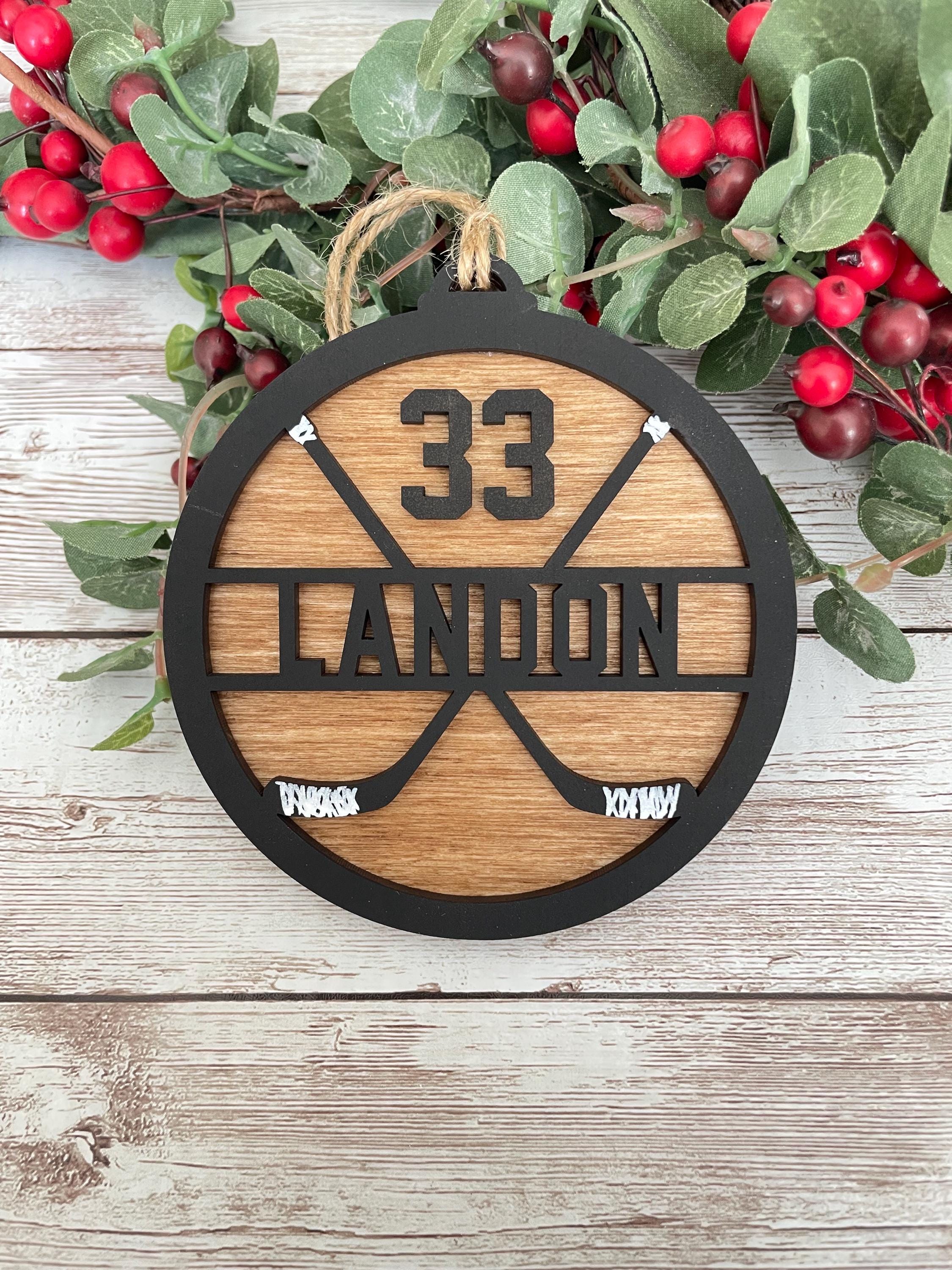 Hockey personalized ornament wood handmade black paint wood stained background twine string to hand sticks hockey team coach manager gift