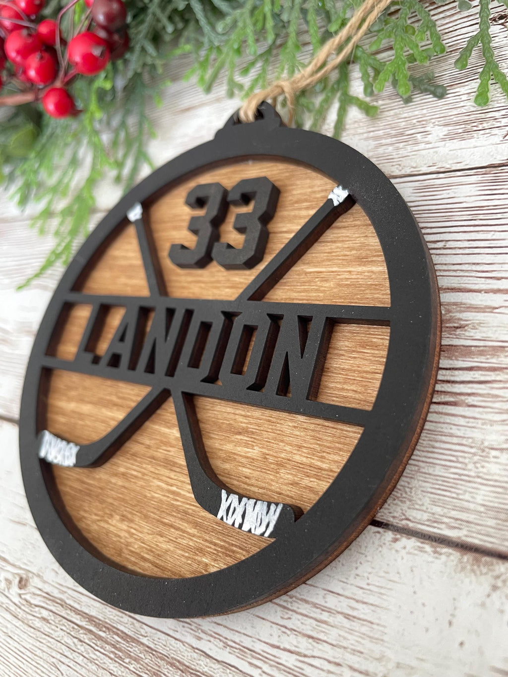 Hockey personalized ornament wood handmade black paint wood stained background twine string to hand sticks hockey team coach manager gift